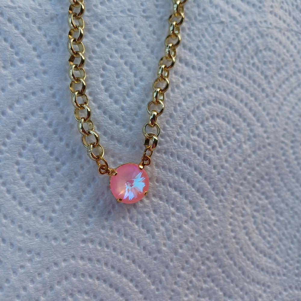 A gold crystal necklace.